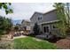 Inviting backyard features a patio dining set, lush grass, and a privacy fence for outdoor gatherings at 1169 Thornbury Pl, Highlands Ranch, CO 80129