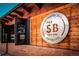 Exterior view of The SB Bar & Grill showcasing unique architectural details and a welcoming outdoor space at 1169 Thornbury Pl, Highlands Ranch, CO 80129