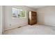 Empty bedroom with neutral carpet and a large wardrobe cabinet at 1169 Thornbury Pl, Highlands Ranch, CO 80129