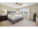 Bright bedroom with a large window, plush carpet, and a comfortable upholstered bed at 1169 Thornbury Pl, Highlands Ranch, CO 80129