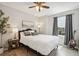 Serene bedroom with a modern decor, wood floors, and a large window for natural light at 1169 Thornbury Pl, Highlands Ranch, CO 80129
