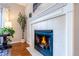Close-up of a beautiful fireplace with white mantel and decorative tile surround at 1169 Thornbury Pl, Highlands Ranch, CO 80129