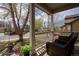 Inviting front porch featuring wicker furniture, offering a cozy outdoor seating area at 1169 Thornbury Pl, Highlands Ranch, CO 80129