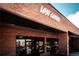 Charming brick facade of Lost Coffee with inviting entrances and modern signage, perfect for coffee lovers at 1169 Thornbury Pl, Highlands Ranch, CO 80129