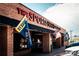 The Sportsbook exterior featuring bold signage, colorful flags, and a lively storefront, attracting sports enthusiasts at 1169 Thornbury Pl, Highlands Ranch, CO 80129
