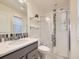 Bathroom featuring a vanity, glass-enclosed shower, and modern fixtures for a clean and functional design at 3921 E 141St Ave, Thornton, CO 80602
