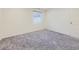 This bedroom has neutral walls and carpet, a window with blinds, and a closet door at 3921 E 141St Ave, Thornton, CO 80602