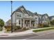 Two-story home with neutral colors and a covered porch, complemented by a landscaped front yard at 3921 E 141St Ave, Thornton, CO 80602