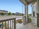 The front porch has decorative columns and a view of the manicured neighborhood at 3921 E 141St Ave, Thornton, CO 80602