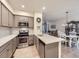 Modern kitchen with stainless steel appliances, stylish cabinets, and quartz countertops at 3921 E 141St Ave, Thornton, CO 80602