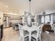Open layout connecting the kitchen, dining, and living areas, creating a spacious and inviting atmosphere at 3921 E 141St Ave, Thornton, CO 80602