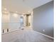 A neutral-toned loft space with carpet, white railings, and access to multiple rooms, offering versatile use at 3921 E 141St Ave, Thornton, CO 80602