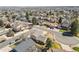 Expansive aerial view of the neighborhood showcasing mature trees and well-maintained homes at 3785 E 134Th Ct, Thornton, CO 80241