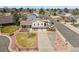 Aerial view of home showcasing landscaping, driveway, and a two-car garage at 3785 E 134Th Ct, Thornton, CO 80241