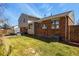 Spacious backyard with lush green grass, patio seating area, and well-maintained landscaping at 3785 E 134Th Ct, Thornton, CO 80241