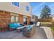 Relaxing patio with outdoor seating, grill, and a slide, perfect for Gathering fun at 3785 E 134Th Ct, Thornton, CO 80241