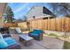 Inviting backyard patio with comfortable seating, a grill, and a fun slide for entertainment at 3785 E 134Th Ct, Thornton, CO 80241