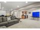 Finished basement featuring a couch and kitchenette, and a ping pong table at 3785 E 134Th Ct, Thornton, CO 80241
