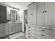 Bright bathroom featuring granite counters, grey cabinets, and a mosaic tile backsplash at 3785 E 134Th Ct, Thornton, CO 80241