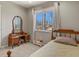 Bedroom with carpet, antique vanity, and lots of natural light at 3785 E 134Th Ct, Thornton, CO 80241
