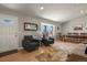 Inviting living area with hardwood floors, comfortable seating, and an open layout that leads to the dining space at 3785 E 134Th Ct, Thornton, CO 80241