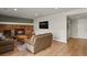 Spacious living room with wood flooring, a brick fireplace, and plenty of natural light, perfect for Gathering enjoyment at 3785 E 134Th Ct, Thornton, CO 80241
