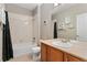 Standard bathroom with a shower-tub combo, toilet, and single sink vanity at 5662 W Peakview Pl, Littleton, CO 80123