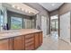 Bathroom with a double vanity, a walk-in shower, tile flooring, and natural light at 5662 W Peakview Pl, Littleton, CO 80123