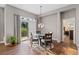 Cozy dining area featuring a glass table, sliding doors, and lots of natural light at 5662 W Peakview Pl, Littleton, CO 80123