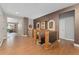 Elegant foyer with hardwood floors, decorative wall niches, and staircase leading to the basement at 5662 W Peakview Pl, Littleton, CO 80123