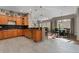 Spacious open kitchen with granite countertops, stainless steel appliances, and tile floors at 5662 W Peakview Pl, Littleton, CO 80123