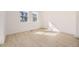 Bright bedroom featuring wood floors, two large windows, and ample natural light at 1989 S Haleyville Way, Aurora, CO 80018