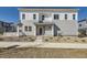 Charming two-story home with gray siding, white trim, and inviting front entrance at 1989 S Haleyville Way, Aurora, CO 80018