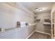 Walk-in closet featuring ample shelving and storage space for organization at 8611 Gold Peak Dr # D, Highlands Ranch, CO 80130