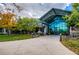 Stunning clubhouse entrance featuring a modern glass facade and meticulously maintained landscaping at 8611 Gold Peak Dr # D, Highlands Ranch, CO 80130