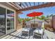 Outdoor deck area featuring sun loungers and outdoor furniture with an umbrella for shade at 8611 Gold Peak Dr # D, Highlands Ranch, CO 80130