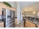 Modern kitchen featuring stainless steel appliances, granite countertops, and wood cabinets at 8611 Gold Peak Dr # D, Highlands Ranch, CO 80130