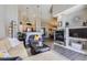 Comfortable living space with a cozy fireplace and an open view to the kitchen and dining area at 8611 Gold Peak Dr # D, Highlands Ranch, CO 80130