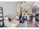 Spacious open-concept living area with stylish furnishings and seamless flow to the kitchen at 8611 Gold Peak Dr # D, Highlands Ranch, CO 80130