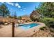 Inviting outdoor pool with lounge chairs, set against a backdrop of a beautifully landscaped yard at 8611 Gold Peak Dr # D, Highlands Ranch, CO 80130