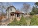 Beautiful backyard with a pergola, stone patio, mature trees and well-manicured landscaping at 18292 E Caspian Pl, Aurora, CO 80013