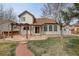 Backyard featuring a pergola, stone patio, walkway, and well-maintained lawn at 18292 E Caspian Pl, Aurora, CO 80013