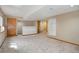 Finished basement with neutral carpet and lighting, great for entertaining or relaxing at 18292 E Caspian Pl, Aurora, CO 80013