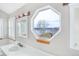 Bathroom showing octagon-shaped window with lake view above vanity and sink at 18292 E Caspian Pl, Aurora, CO 80013