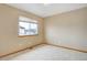 Simple bedroom featuring carpet and a window for natural light at 18292 E Caspian Pl, Aurora, CO 80013