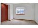Cozy bedroom with neutral carpet, white walls and a view of the water at 18292 E Caspian Pl, Aurora, CO 80013