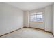 Neutral bedroom with a cozy carpet, a window, and trim at 18292 E Caspian Pl, Aurora, CO 80013