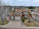 Charming two-story home with a well-manicured lawn, three-car garage, and beautiful landscaping at 18292 E Caspian Pl, Aurora, CO 80013