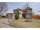 Charming home with well-manicured lawn, mature trees and three-car garage at 18292 E Caspian Pl, Aurora, CO 80013