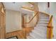 Elegant foyer with hardwood floors, grand staircase, and warm lighting at 18292 E Caspian Pl, Aurora, CO 80013